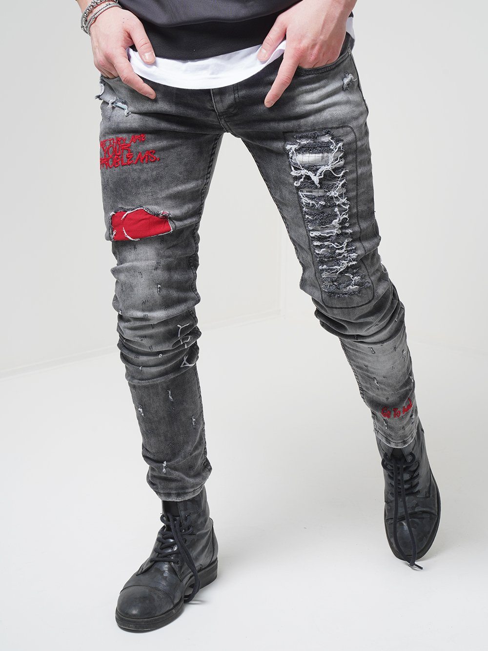 Front shot of a man wearing skinny streetwear jeans called THE OUTLAW Jeans by SERNES