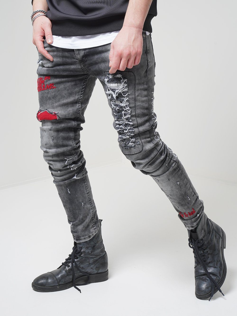 Side shot of a Man wearing skinny streetwear jeans called THE OUTLAW Jeans by SERNES