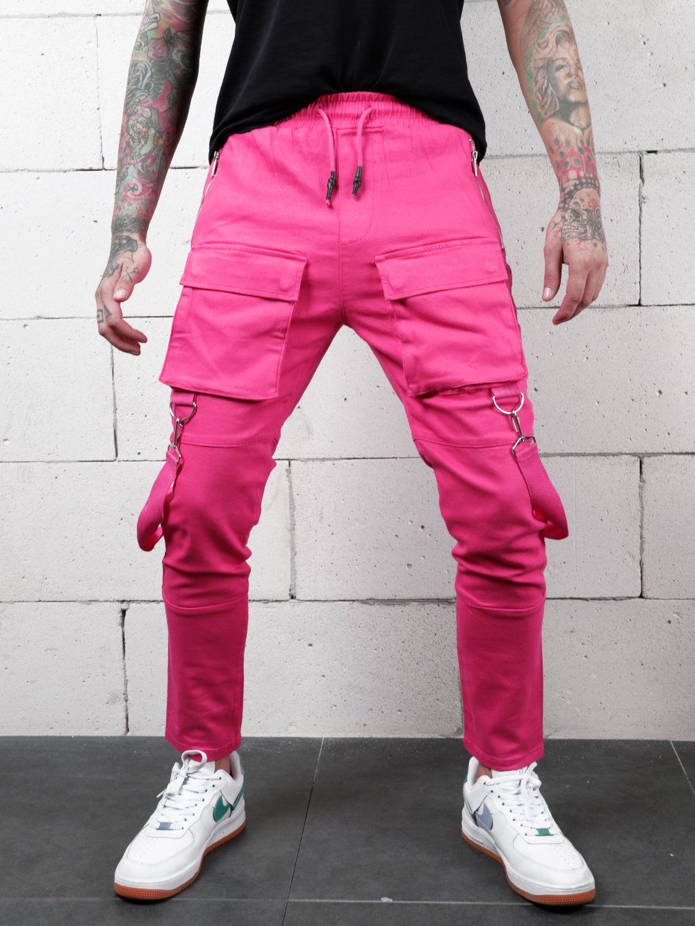A man wearing a PINK BRONX cargo pants.