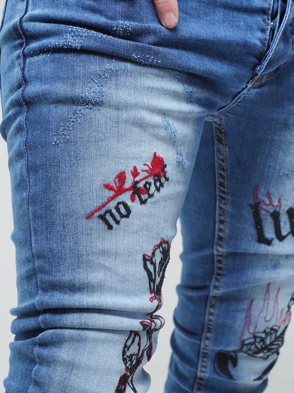 Lower body shot of a man wearing ROSE TATTOO skinny jeans 