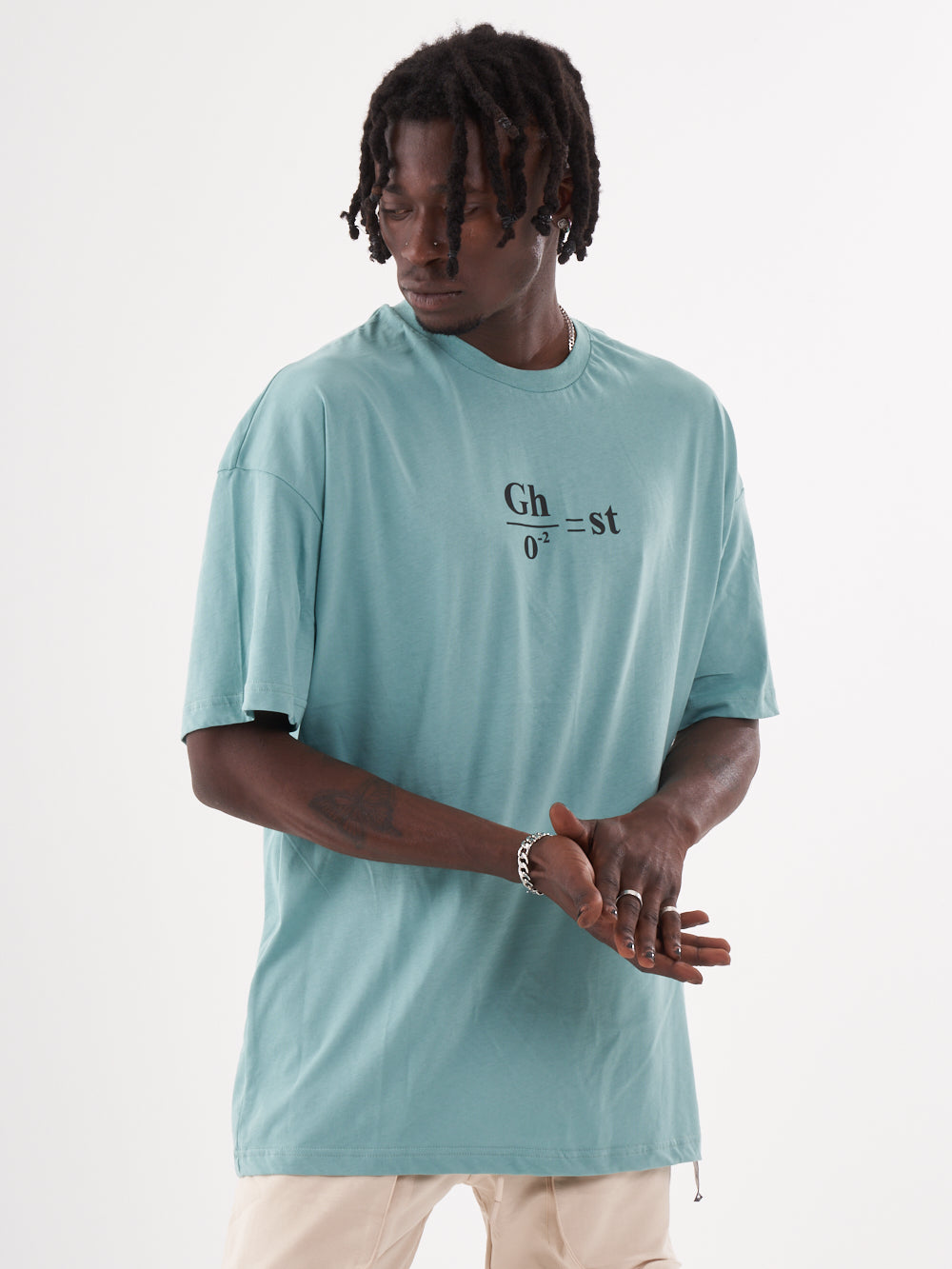 A man wearing a blue GHOST T-SHIRT with the word ghetto on it.