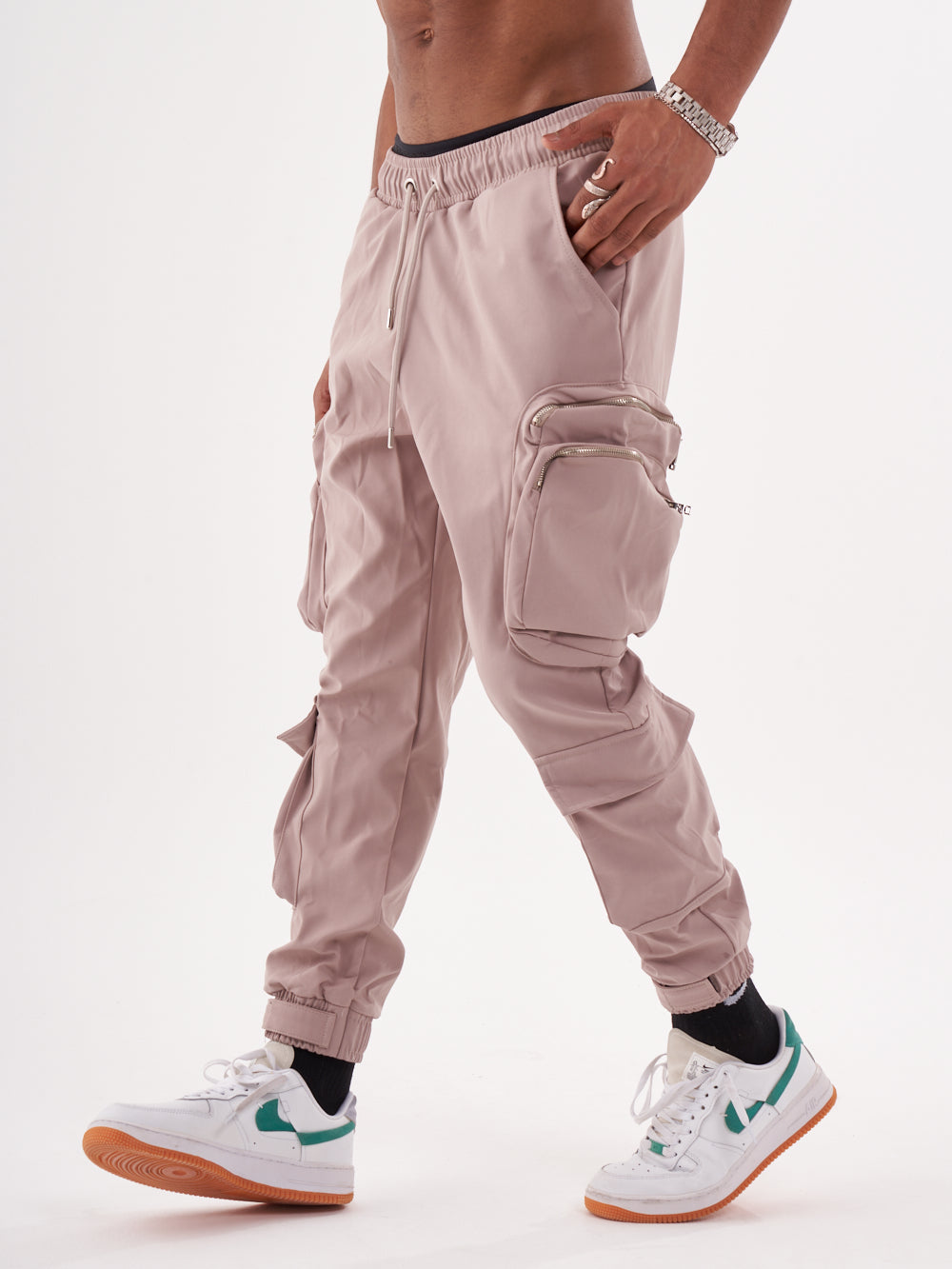 A man wearing Spunk Joggers | Mauve cargo jogger pants.