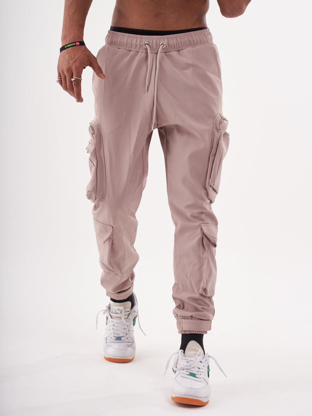A man wearing SPUNK JOGGERS | MAUVE cargo jogger pants.