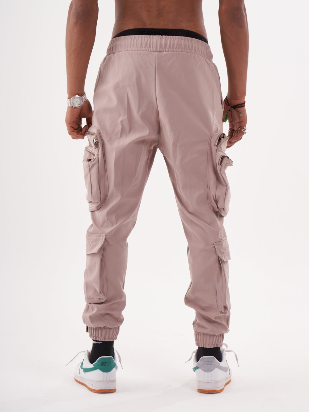 The back view of a man wearing Spunk Joggers | Mauve.