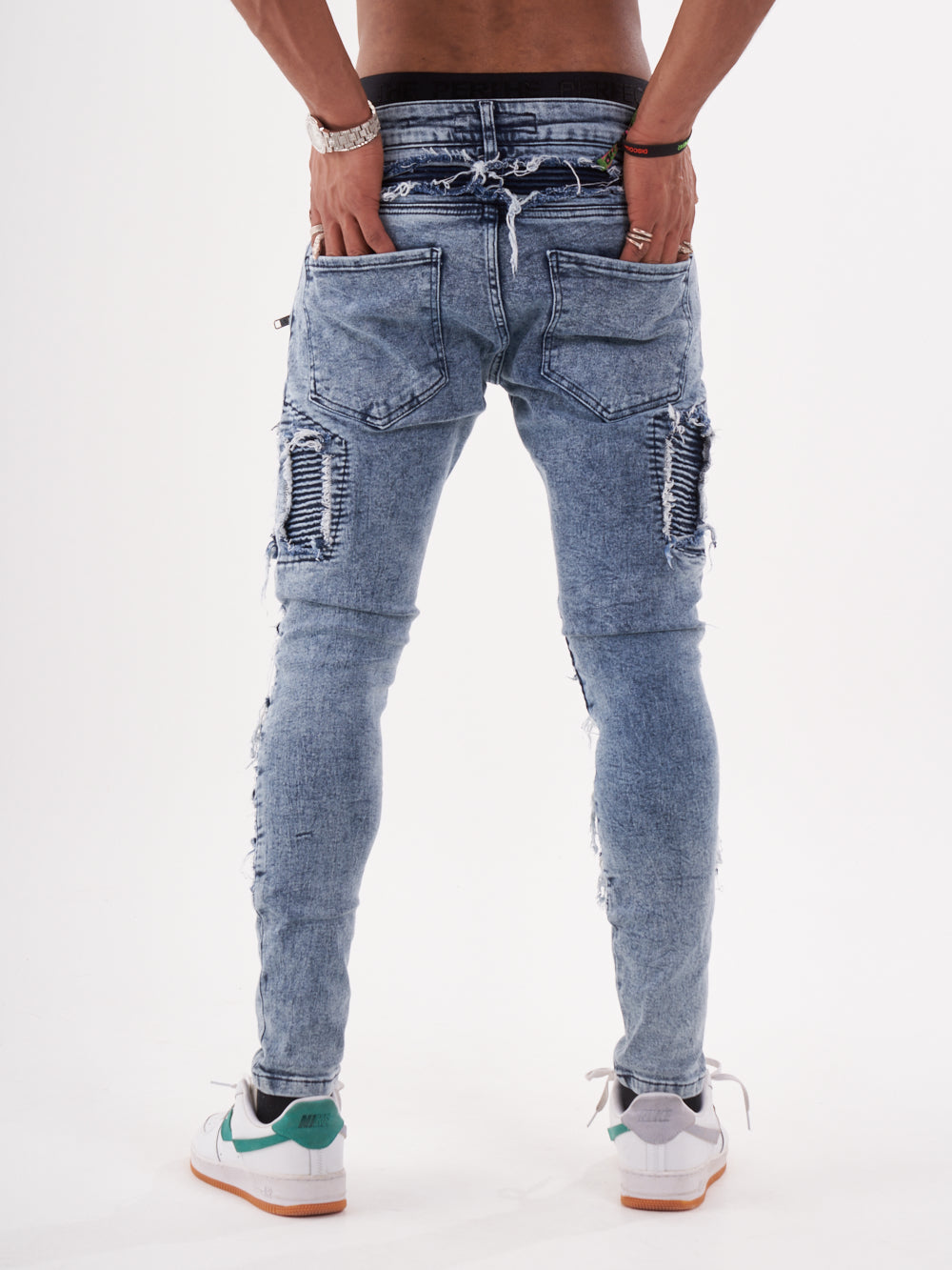 The back view of a man wearing RADICAL denim jeans.