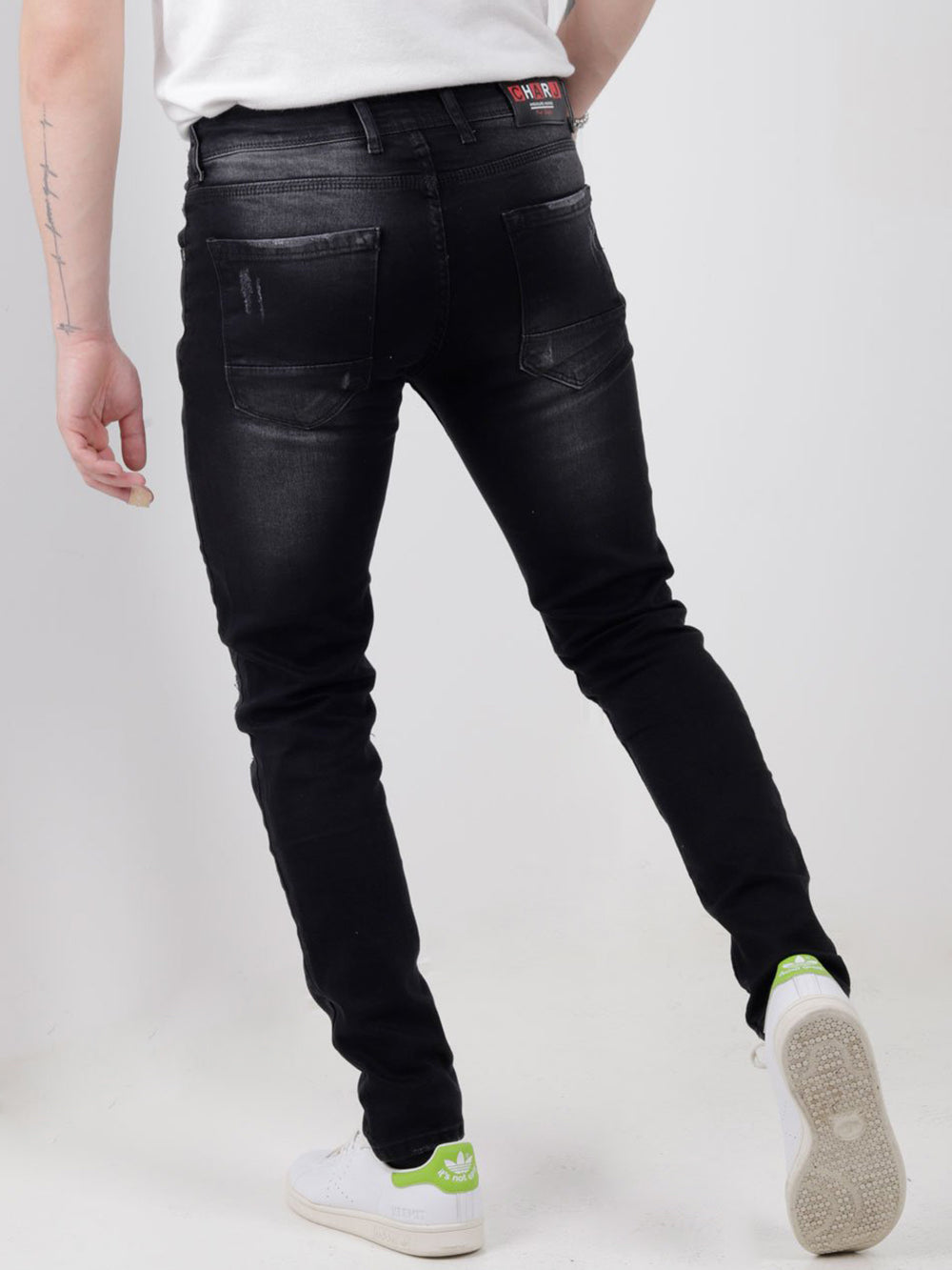 The back view of a man wearing MOONLISA jeans.